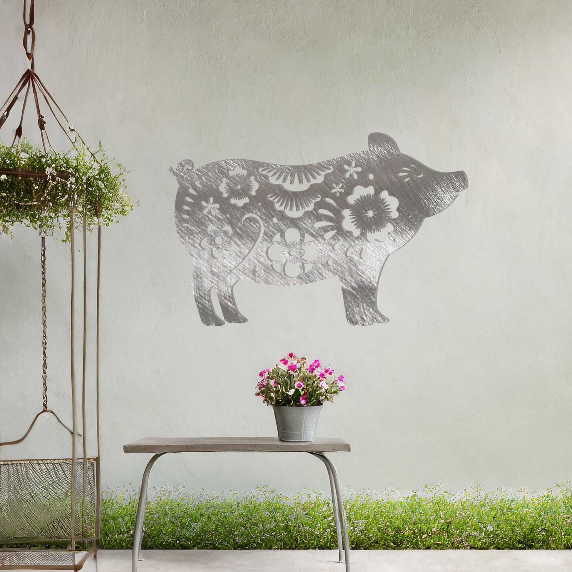 This design features a charming pig silhouette adorned with delicate floral patterns and intricate decorative details. The whimsical style of the artwork makes it a delightful addition to spaces looking for a playful yet artistic element. Perfect for rustic or countryside-inspired settings.