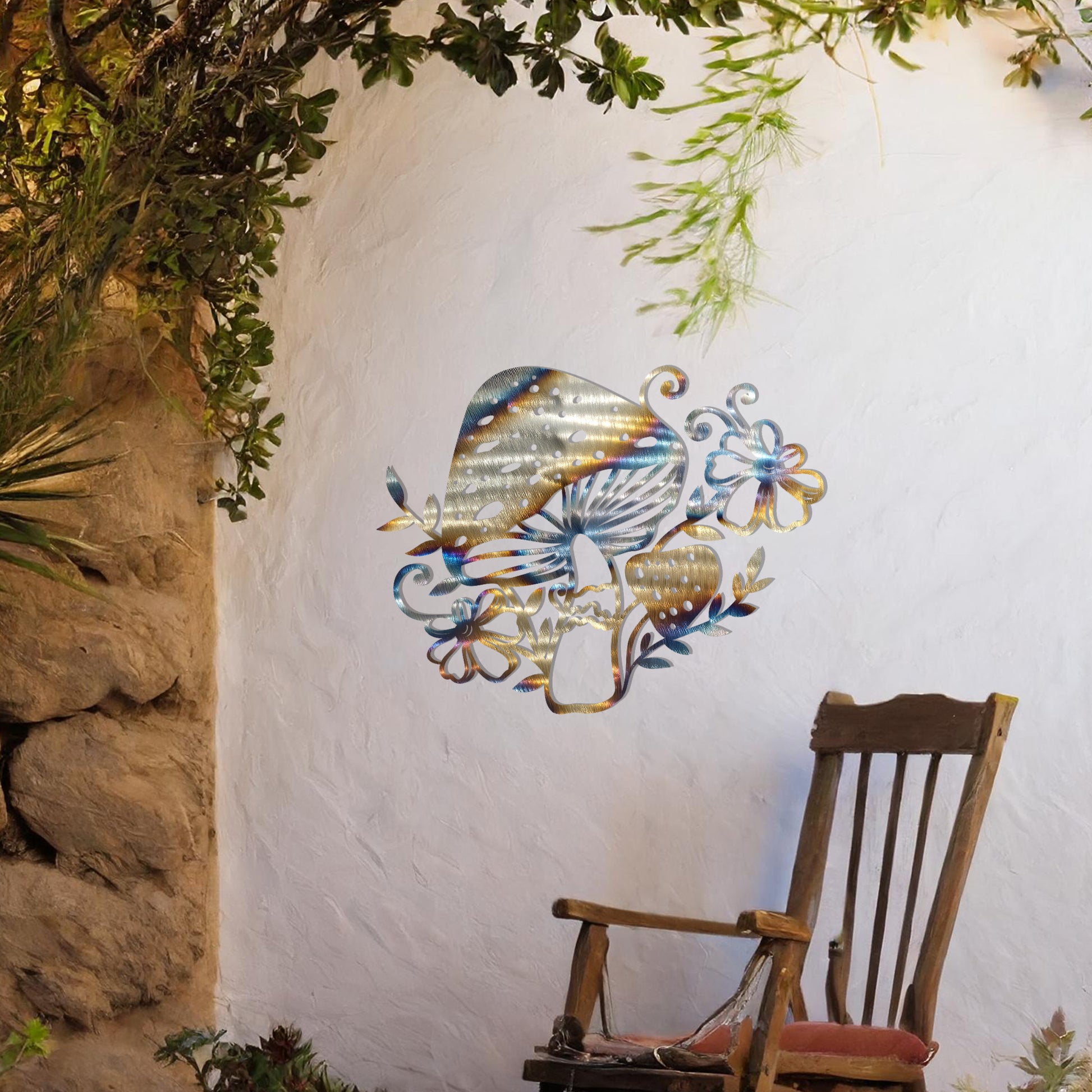 Metal garden decoration featuring a whimsical mushroom design surrounded by floral and leafy accents, intricately crafted to bring a touch of nature-inspired charm and artistry to outdoor spaces