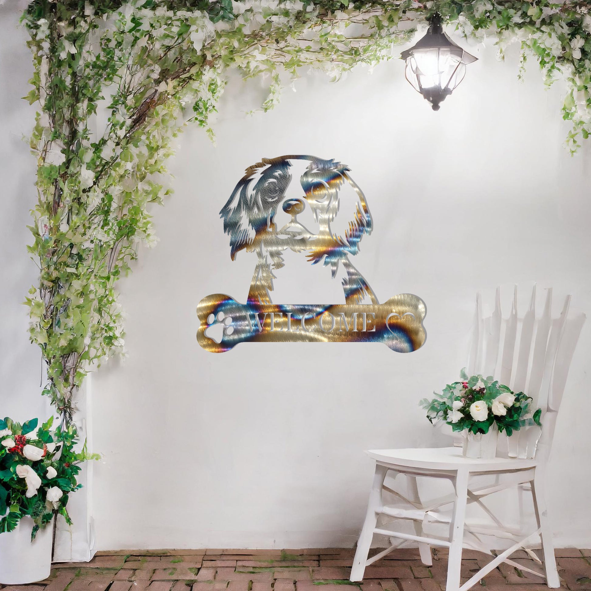 Metal Cavalier King Charles Spaniel dog design with a bone-shaped 'WELCOME' text and paw prints, perfect for adding a charming and welcoming touch to entryways or outdoor spaces.