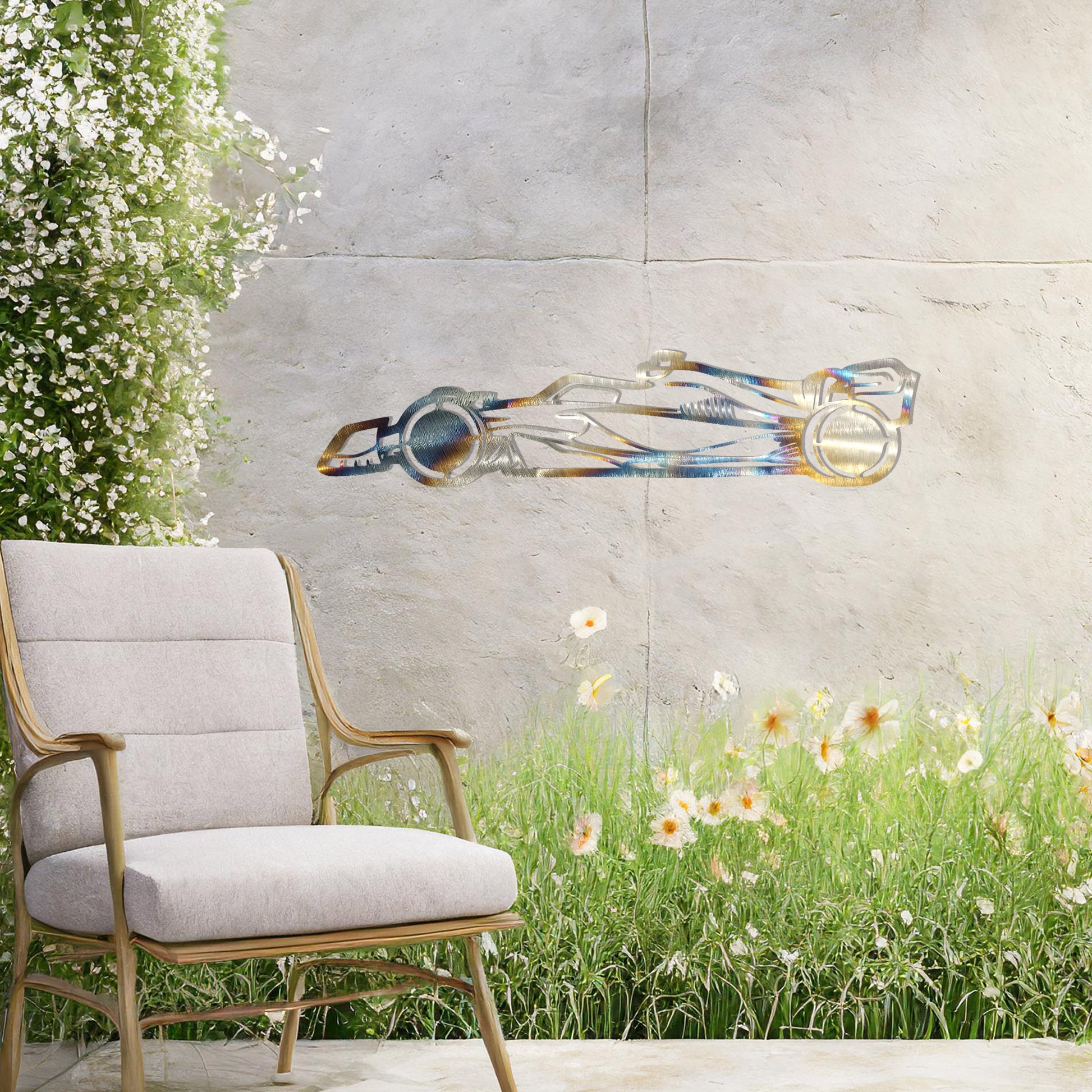 A sleek metal wall art design showcasing a detailed Formula 1 car silhouette. Perfect for motorsport enthusiasts, this artwork brings dynamic energy to modern or contemporary spaces. It is displayed on a neutral wall in a stylish outdoor setting.