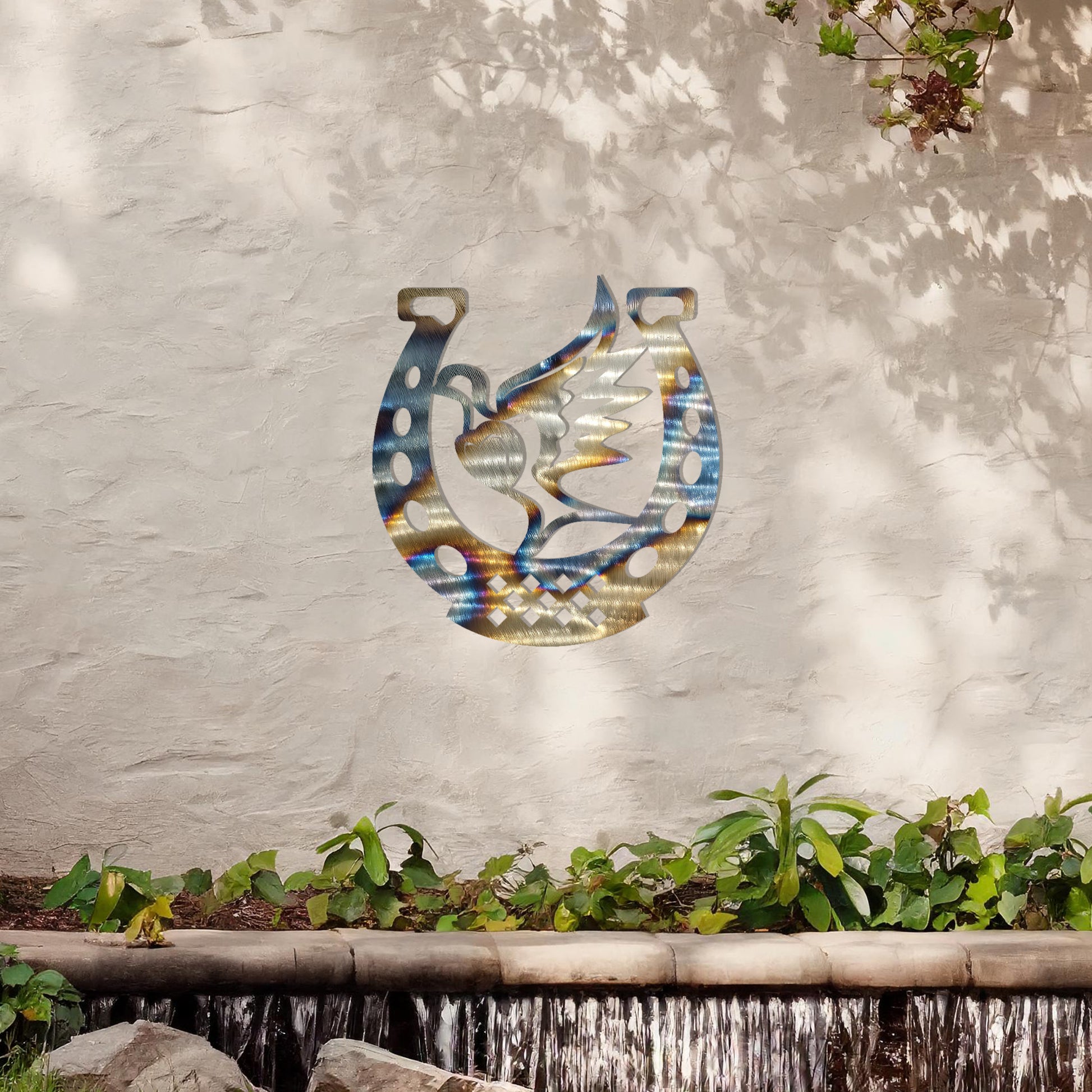 This wall art features a horseshoe design with a dove in flight carrying a heart at its center, symbolising peace and luck. A meaningful and stylish addition to any space with its intricate details and balanced composition.
