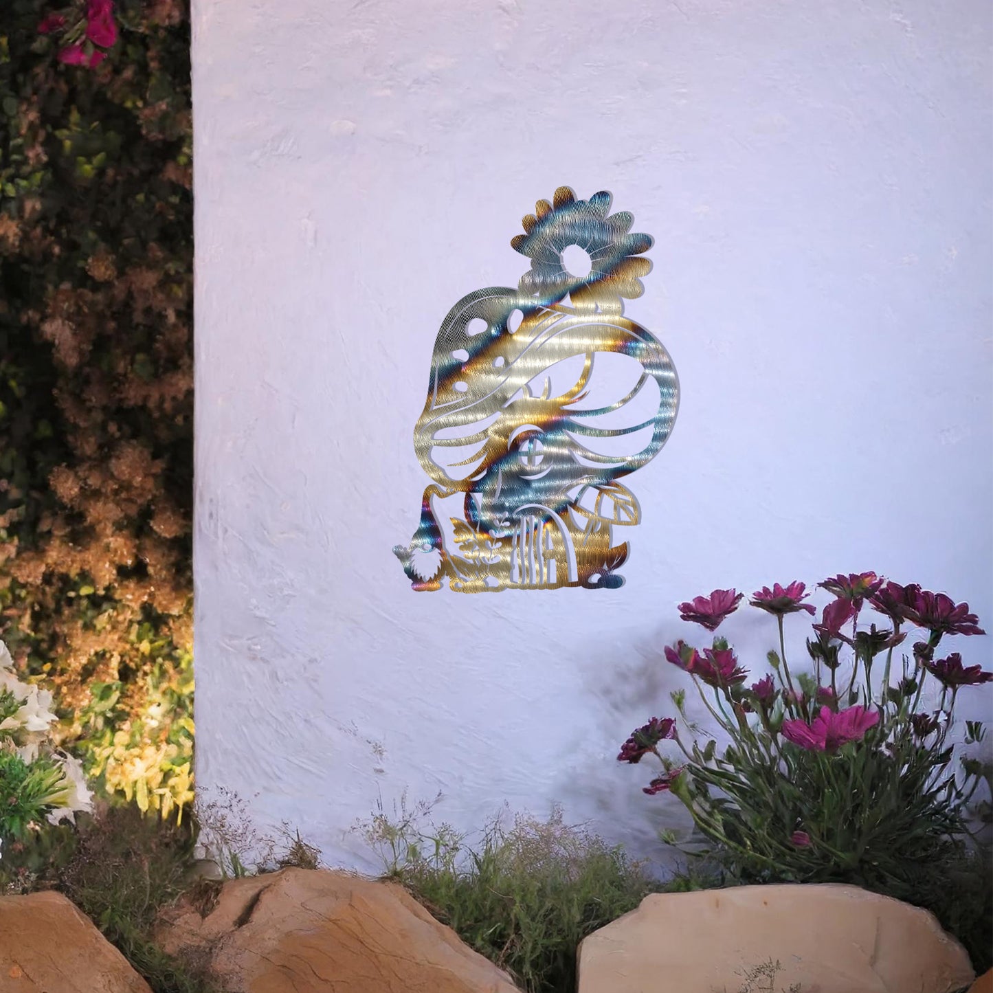 Metal garden decoration featuring a whimsical mushroom house adorned with floral and foliage details, crafted with intricate patterns, adding an enchanting and playful touch to outdoor or indoor spaces.