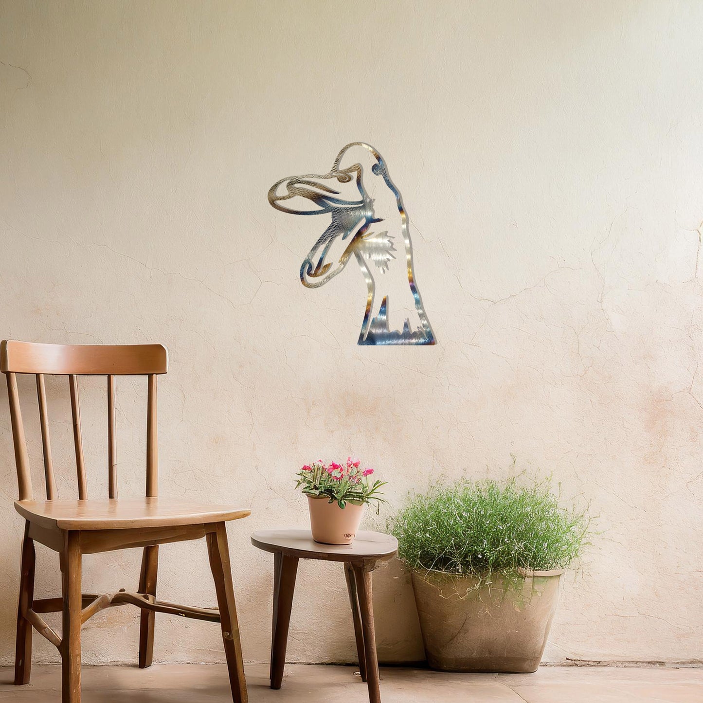 A quirky metal wall art of a duck with an open beak, showcasing playful and artistic detail. This unique design adds a touch of humor and charm to any modern setting, surrounded by greenery and soft floral accents.