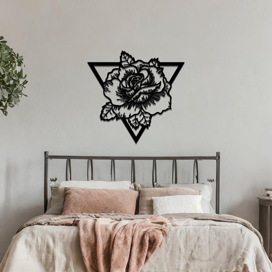 Metal wall art featuring a detailed rose design framed within a geometric triangle, mounted on a neutral wall within modern bedroom decor. The combination of floral and geometric elements creates a bold and elegant focal point, enhancing the room's contemporary style.