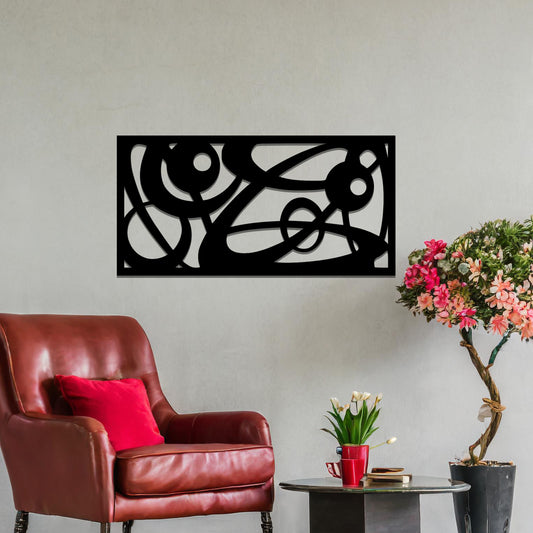 Metal wall art featuring a long, rectangular design with abstract swirling patterns and geometric shapes, mounted on a neutral wall within modern decor. The bold lines and shapes create an eye-catching focal point, adding a touch of artistic flair to the space.