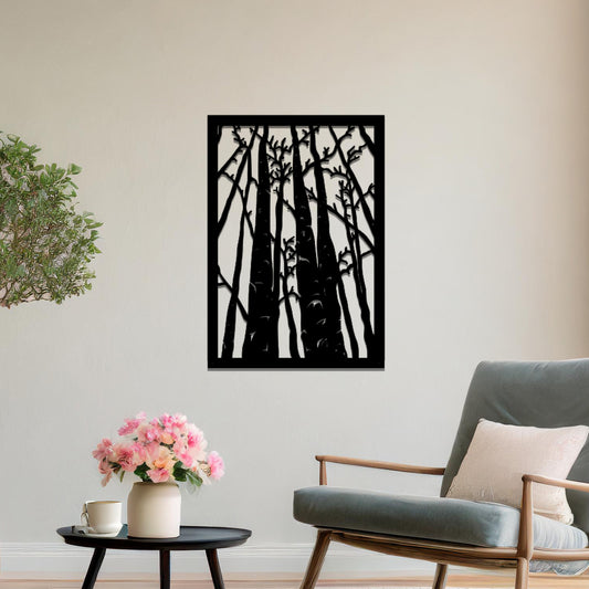 Metal wall art featuring a rectangular design of tall trees with bare branches, showcasing intricate details, displayed on a neutral wall within modern decor.