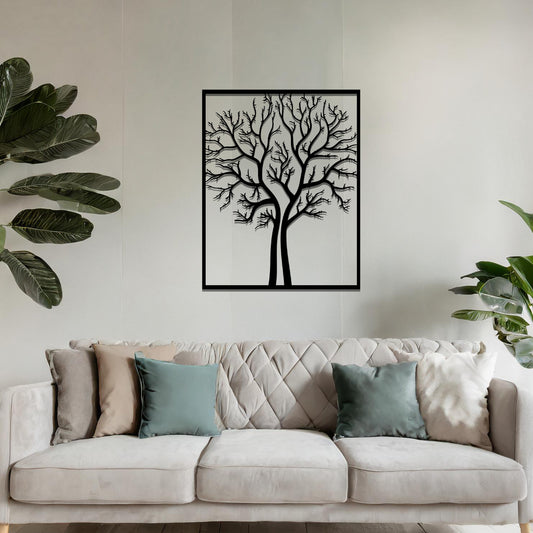 Metal wall art featuring a framed tree design with intricate, bare branches, crafted with precise laser-cut techniques, displayed on a neutral wall within modern decor.
