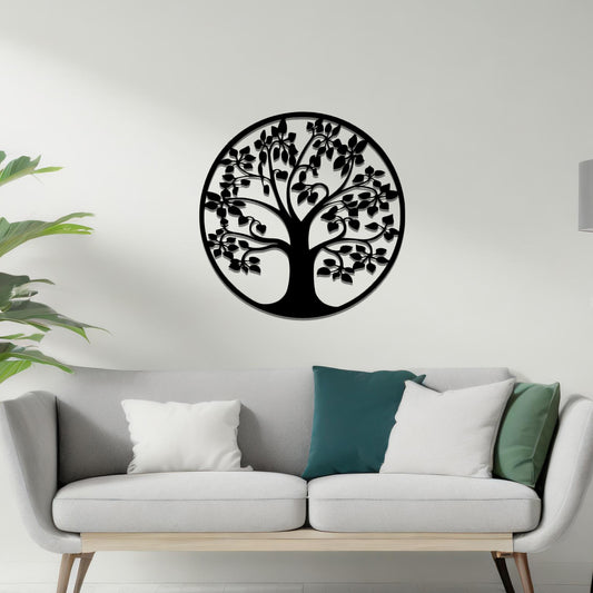 Metal wall art featuring a circular tree design with a detailed trunk, branches, and leaves, crafted with precise laser-cut techniques, displayed on a neutral wall within modern decor.