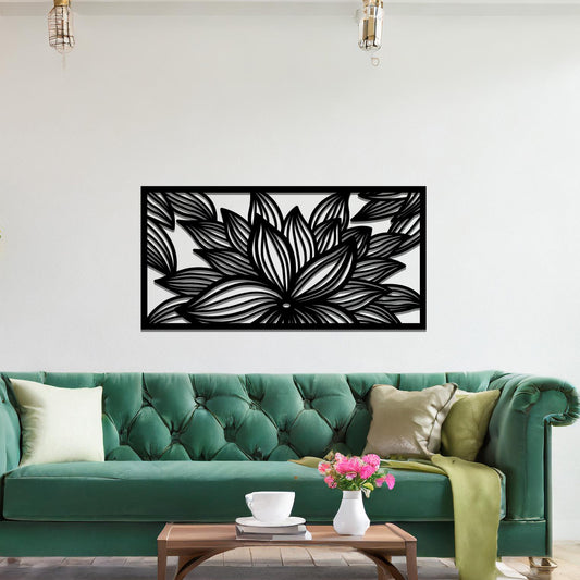 A metal wall art design showcasing a lotus flower with detailed, flowing petals. The design is framed within a rectangular shape. The art is displayed on a neutral wall within a modern living room setting, complementing the room's elegant decor.