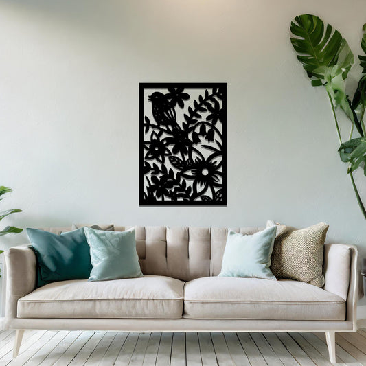 Metal wall art featuring a rectangular design with a bird perched amidst detailed floral and leafy patterns, mounted on a neutral wall within modern room decor. The intricate details and natural elements create a lively and elegant focal point.