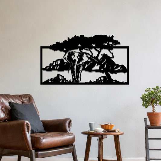 Metal wall art featuring an elephant silhouette under a tree with mountains in the background. The design is framed and placed on a neutral wall with contemporary furniture.