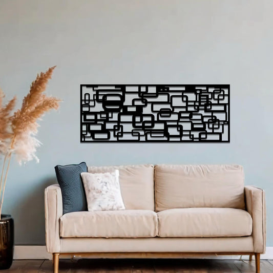 Metal wall art featuring an abstract geometric design with overlapping and interlocking rectangular shapes. The artwork is placed on a neutral wall in a modern living room, complementing contemporary decor with its dynamic and stylish form.