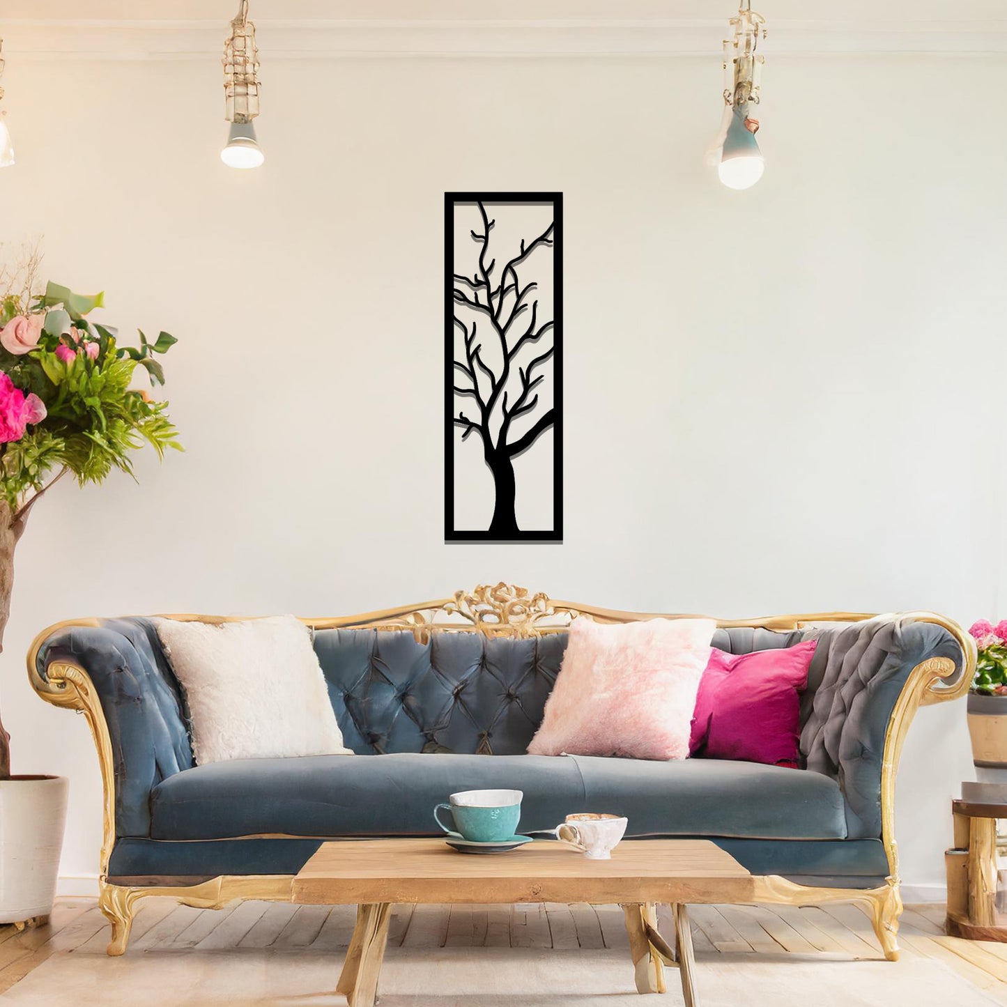 Metal wall art featuring a vertical design of a bare tree with intricate branches, mounted on a neutral wall within elegant room decor. The minimalist silhouette of the tree adds a sophisticated, natural focal point to the space.