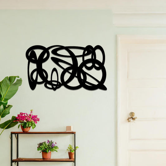 Metal wall art featuring a dynamic, abstract design with overlapping loops and curves. The art is placed on a neutral wall within modern room decor, creating a bold and fluid statement in the space.