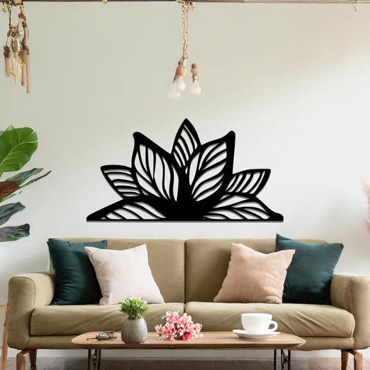 A beautifully intricate metal wall art design featuring a large, stylized lotus flower with detailed, flowing leaves. The art piece is placed on a neutral wall within a modern living room, adding elegance and natural beauty to the space.