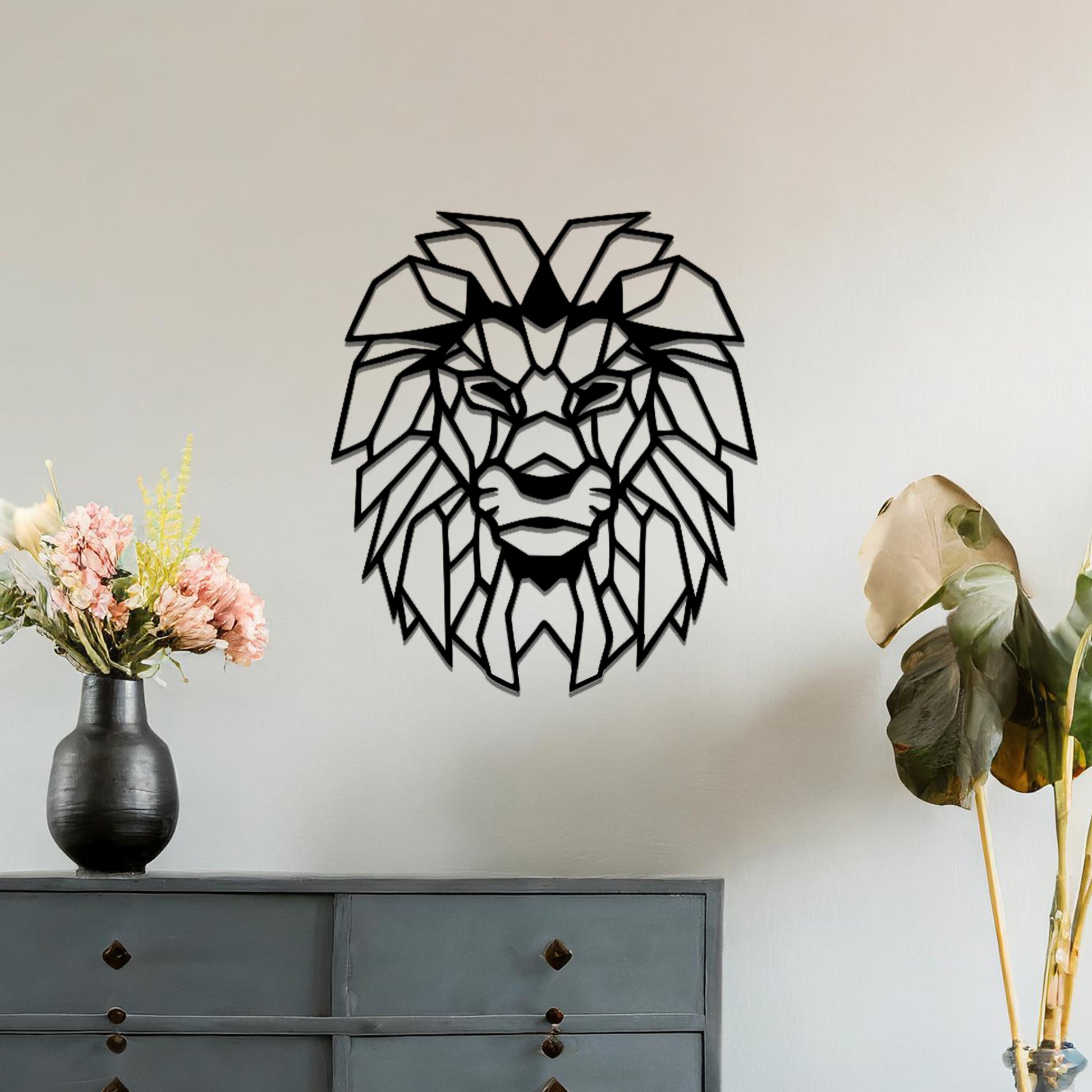Metal wall art featuring a geometric lion head design with intricate angular detailing, crafted with precise laser-cut techniques, displayed on a neutral wall within modern decor.
