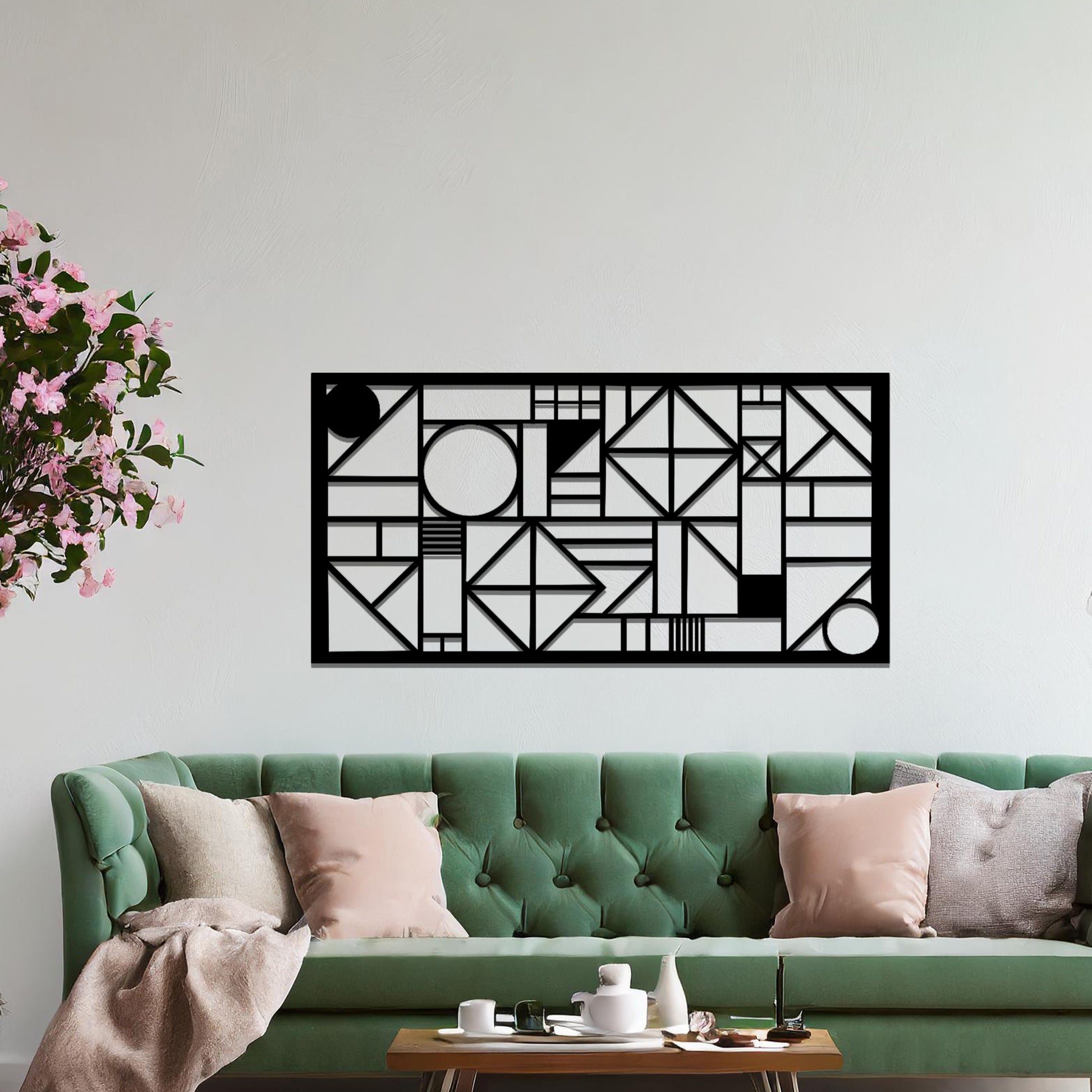 Metal wall art with a geometric design, featuring various abstract shapes, lines, and angles arranged in a structured composition. The art is placed on a neutral wall within modern room decor, adding an artistic touch to the space.