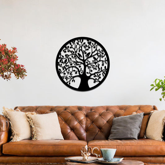Metal wall art featuring a circular tree design with intricate branches and leaves, showcasing a detailed and balanced composition, displayed on a neutral wall within modern decor.
