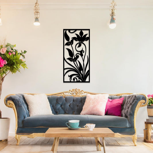 Metal wall art featuring a vertical design with elegant floral motifs and intricate swirling patterns, mounted on a neutral wall within sophisticated room decor. The delicate floral silhouette adds a refined and artistic touch to the space.