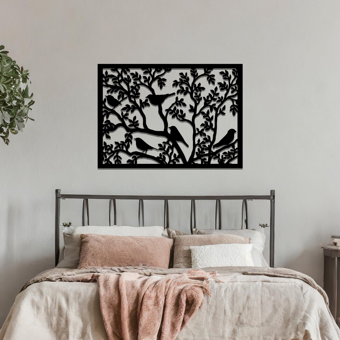 An intricately designed wall art piece showcasing birds perched on branches surrounded by delicate leaves, bringing a serene and natural touch to your interior space.