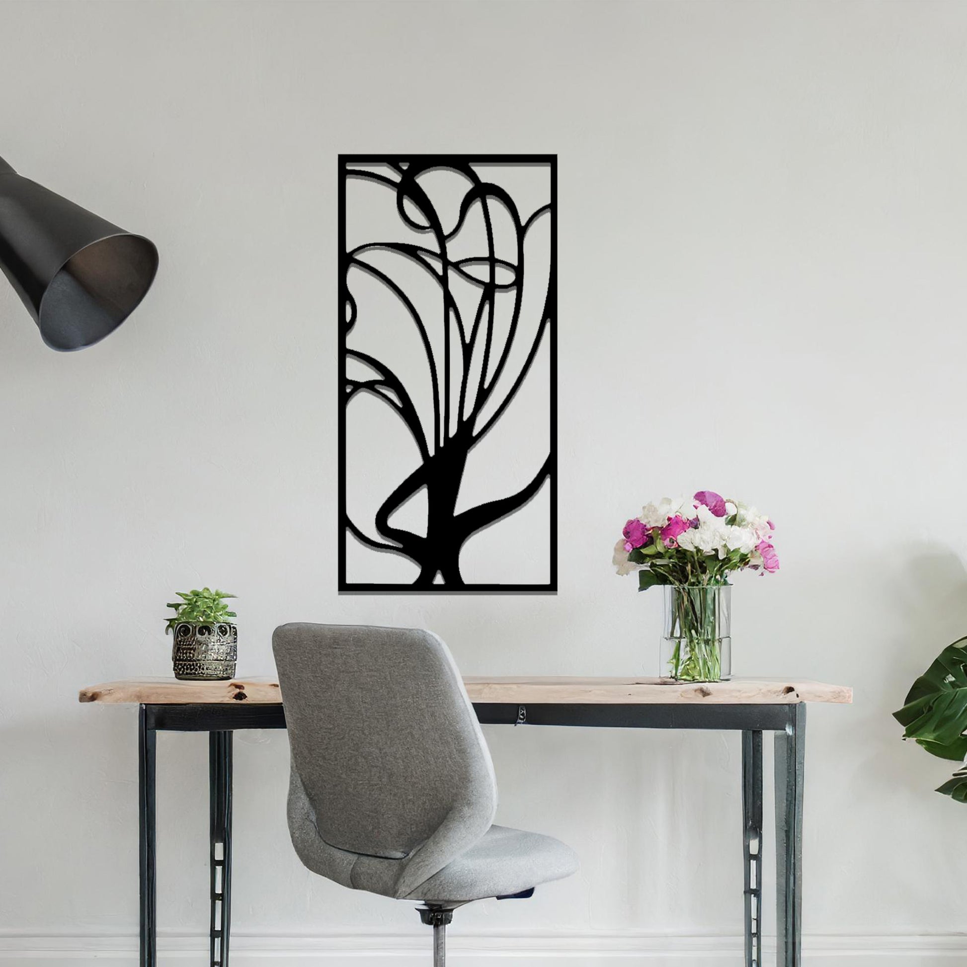 Metal wall art featuring a rectangular abstract design with flowing, interconnected lines, adding a modern and artistic element to the space.