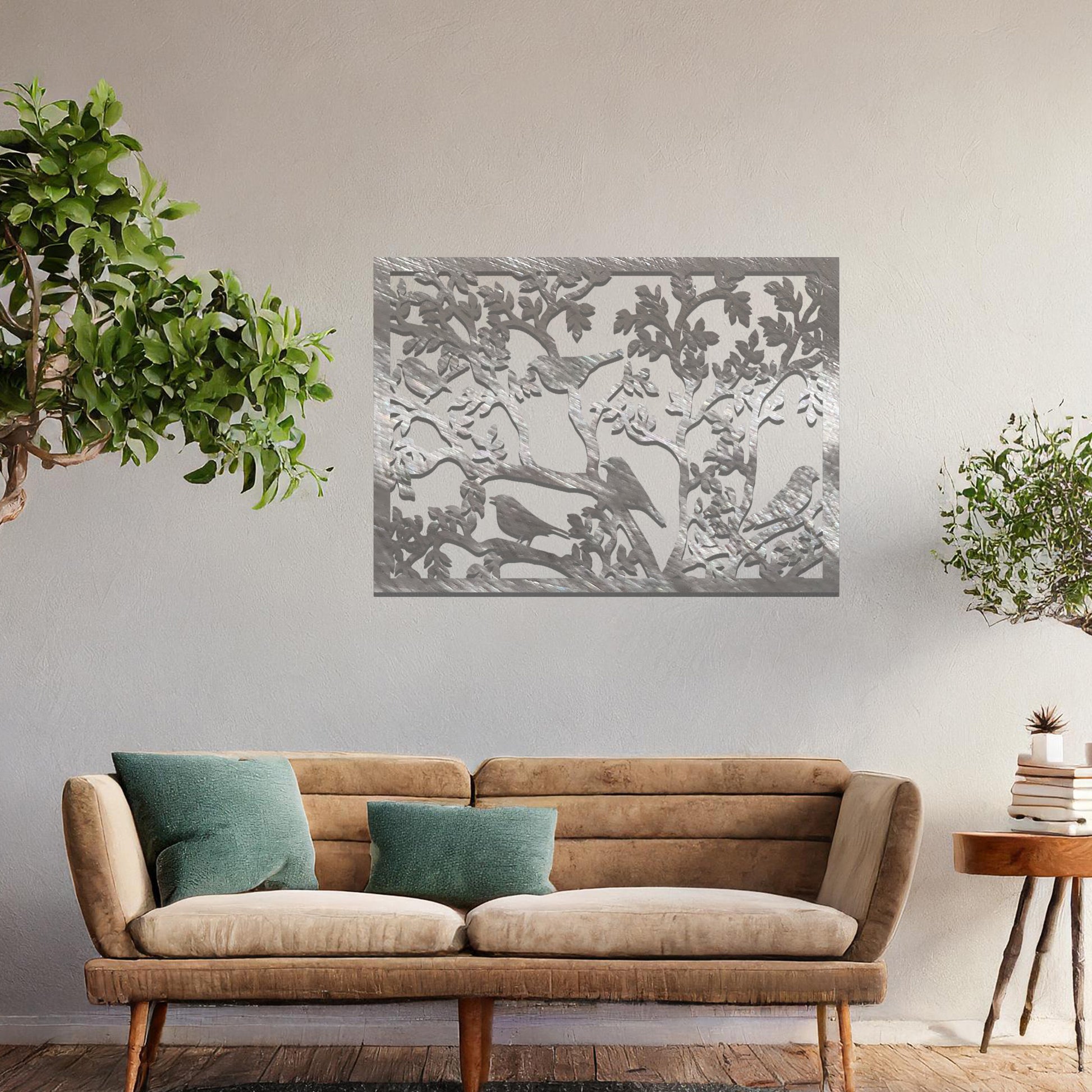 An intricately designed wall art piece showcasing birds perched on branches surrounded by delicate leaves, bringing a serene and natural touch to your interior space.