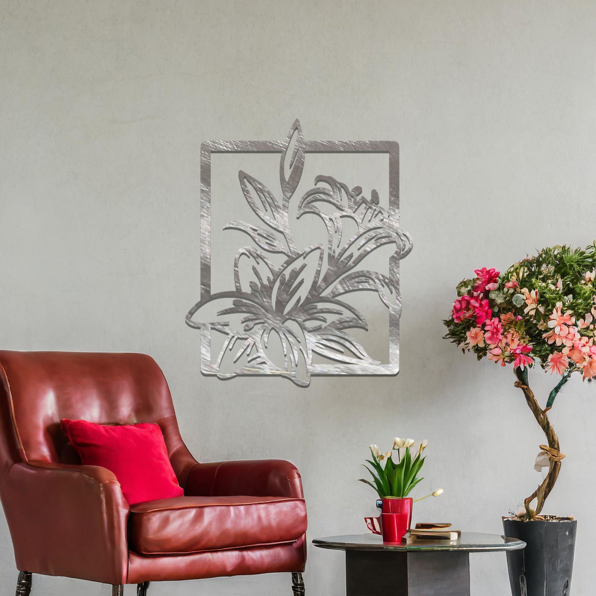 Metal wall art featuring a rectangular design with elegant floral motifs, including detailed lilies and leaves, adding a touch of sophistication and natural beauty to the space.