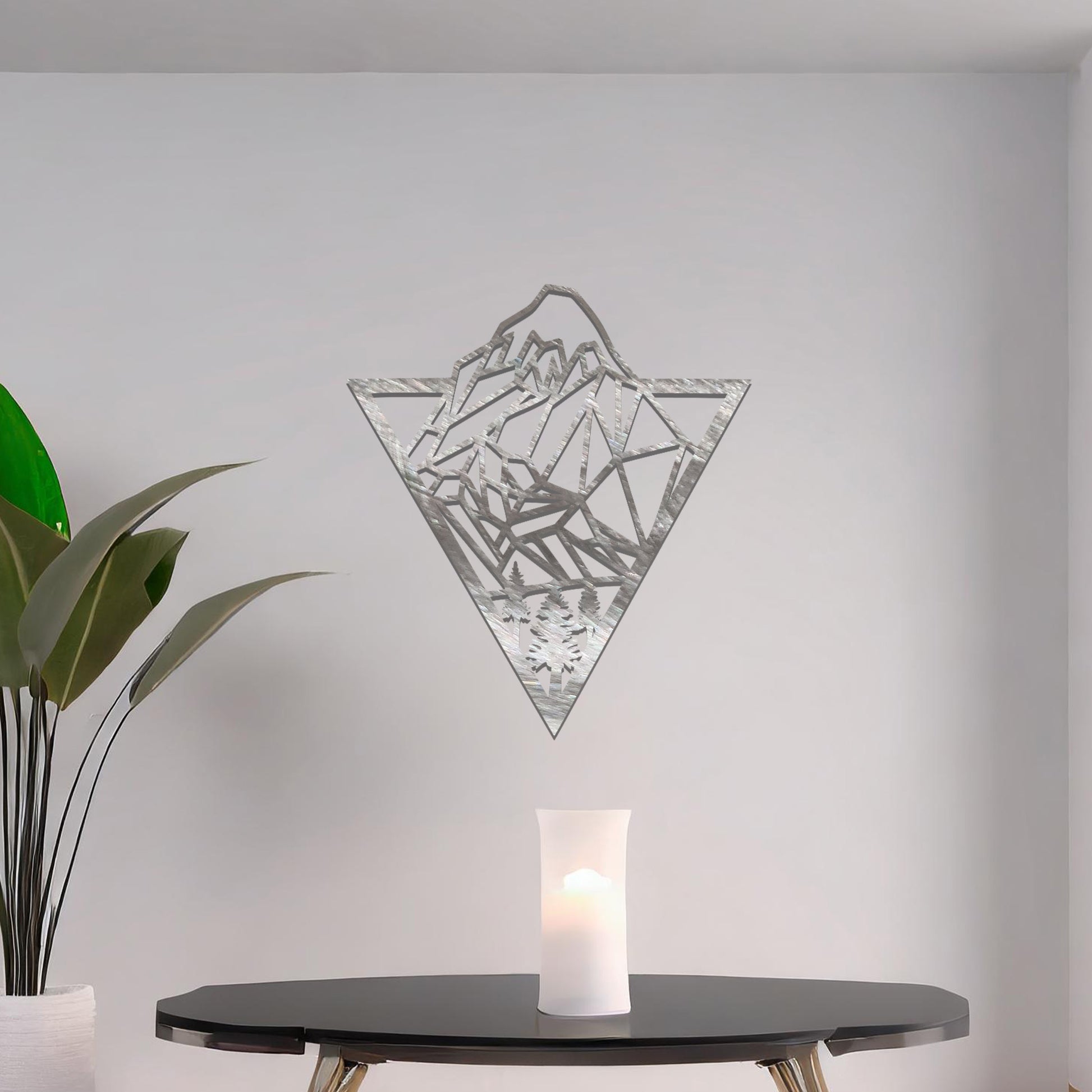 Geometric mountain and forest design within a triangular frame, offering a modern and minimalist aesthetic for a nature-inspired wall art piece.