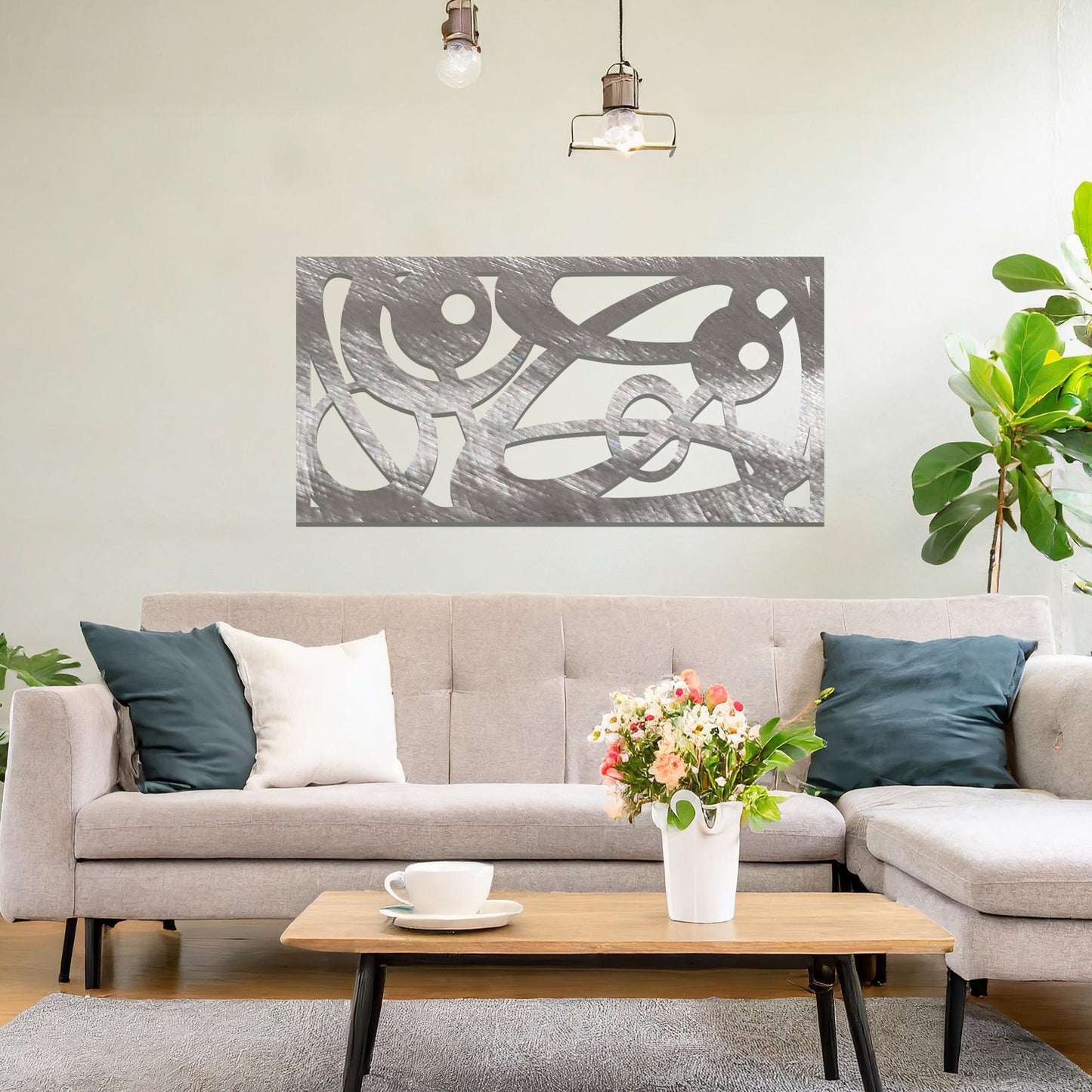 Metal wall art featuring a long, rectangular design with abstract swirling patterns and geometric shapes, mounted on a neutral wall within modern decor. The bold lines and shapes create an eye-catching focal point, adding a touch of artistic flair to the space.