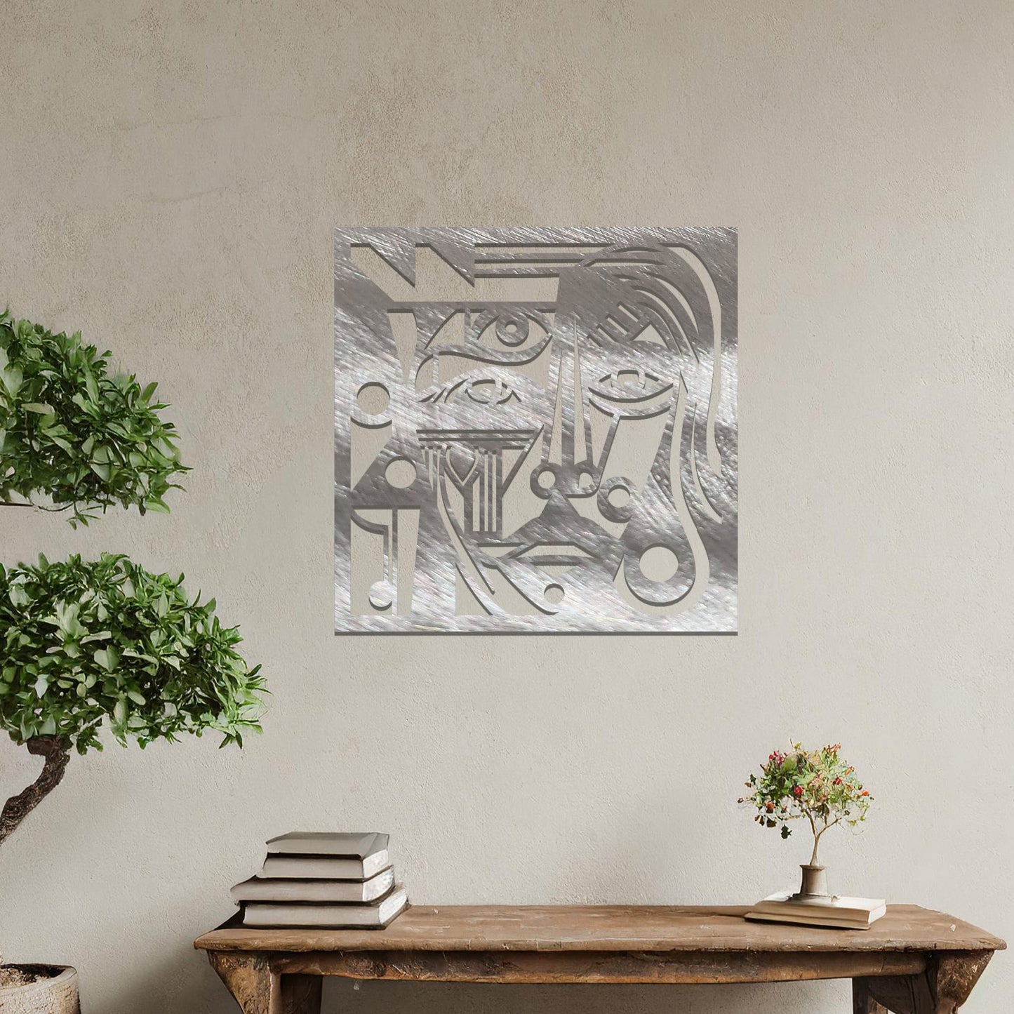 Abstract geometric face design with bold lines, circles, and angles, creating a striking, stylized portrait. The art is displayed on a neutral wall in a modern room setting with minimalistic decor.