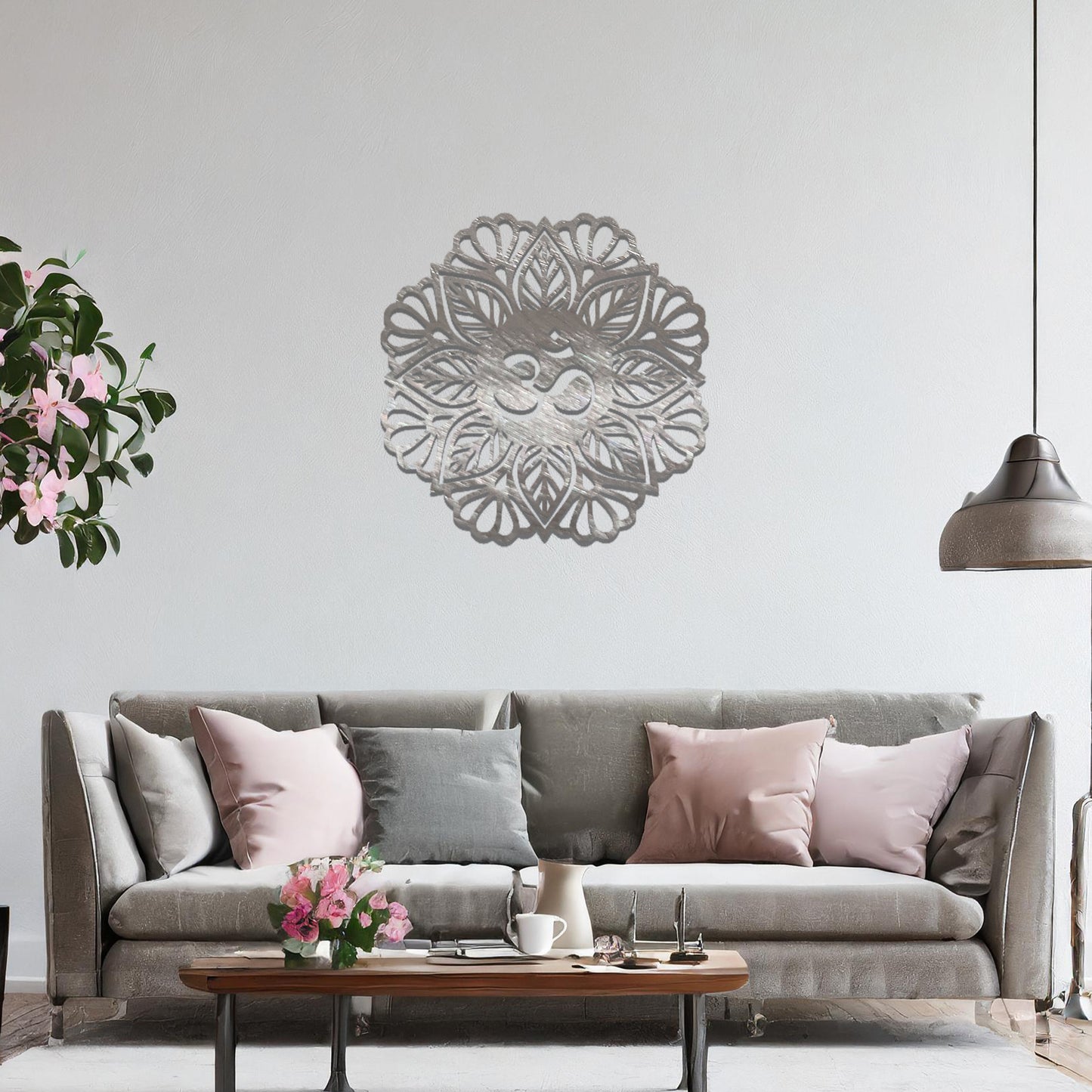 Metal wall art featuring an intricate mandala design with the Om symbol at its center, mounted on a neutral wall within modern decor. The spiritual motif and detailed craftsmanship create a calming and elegant focal point.