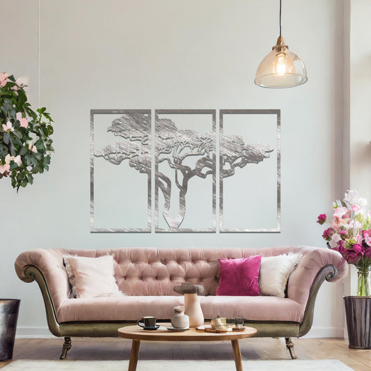Metal wall art featuring a three-panel design with a stylised tree silhouette, mounted on a neutral wall within a modern artistic setting. The rust finish and detailed tree branches create a natural and calming focal point for the room.