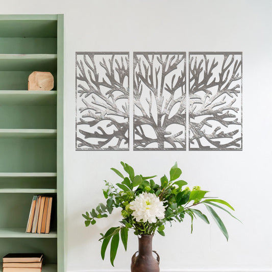 Metal wall art design featuring a stylized tree with intricate branches, presented in a triptych layout. The design captures detailed, organic lines forming the tree’s structure, emphasizing the natural flow and texture of the branches. The art is displayed on a neutral wall.