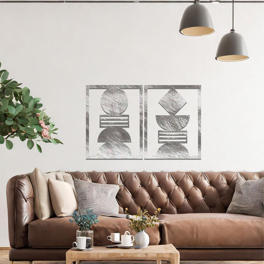 A metal wall art set featuring geometric shapes, including circles and a diamond, arranged in a balanced and symmetrical design. The art is displayed on a neutral wall within modern room decor, adding an elegant and abstract touch to the space.