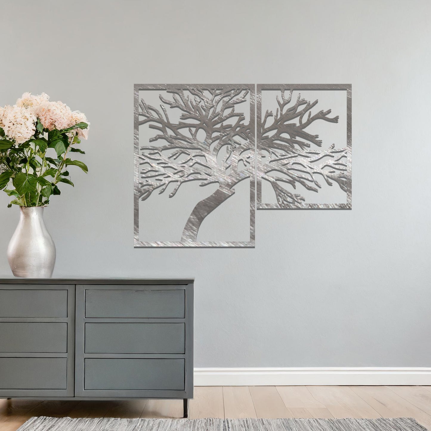 Metal wall art featuring a two-panel design with an intricate tree silhouette, mounted on a neutral wall within modern bedroom decor. The rust finish adds warmth, and the detailed branches create a beautiful and organic focal point.