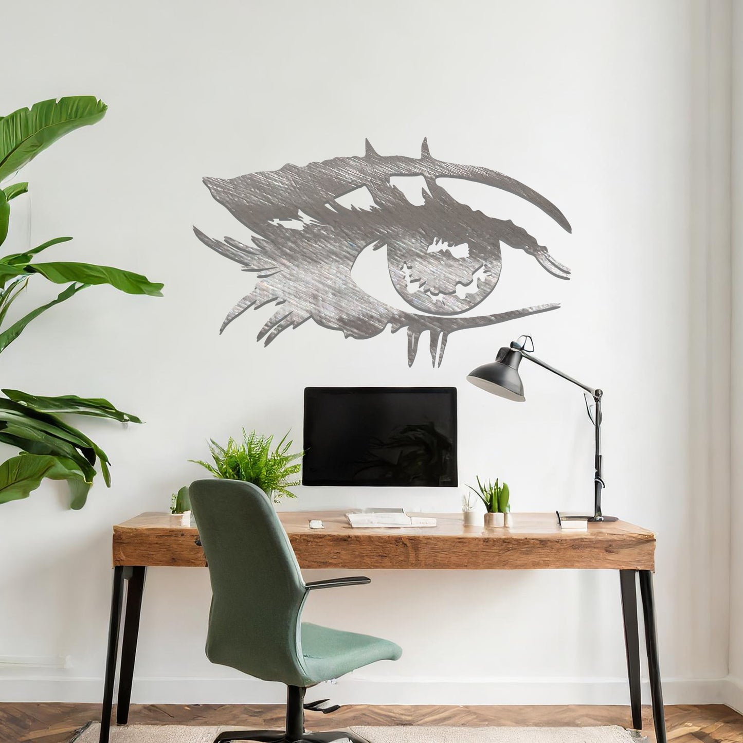 Striking metal wall art featuring a bold and artistic eye design with intricate detailing, mounted on a neutral wall within modern room decor. The focus is entirely on the creative and contemporary craftsmanship of the wall art, enhancing the space's aesthetic appeal.