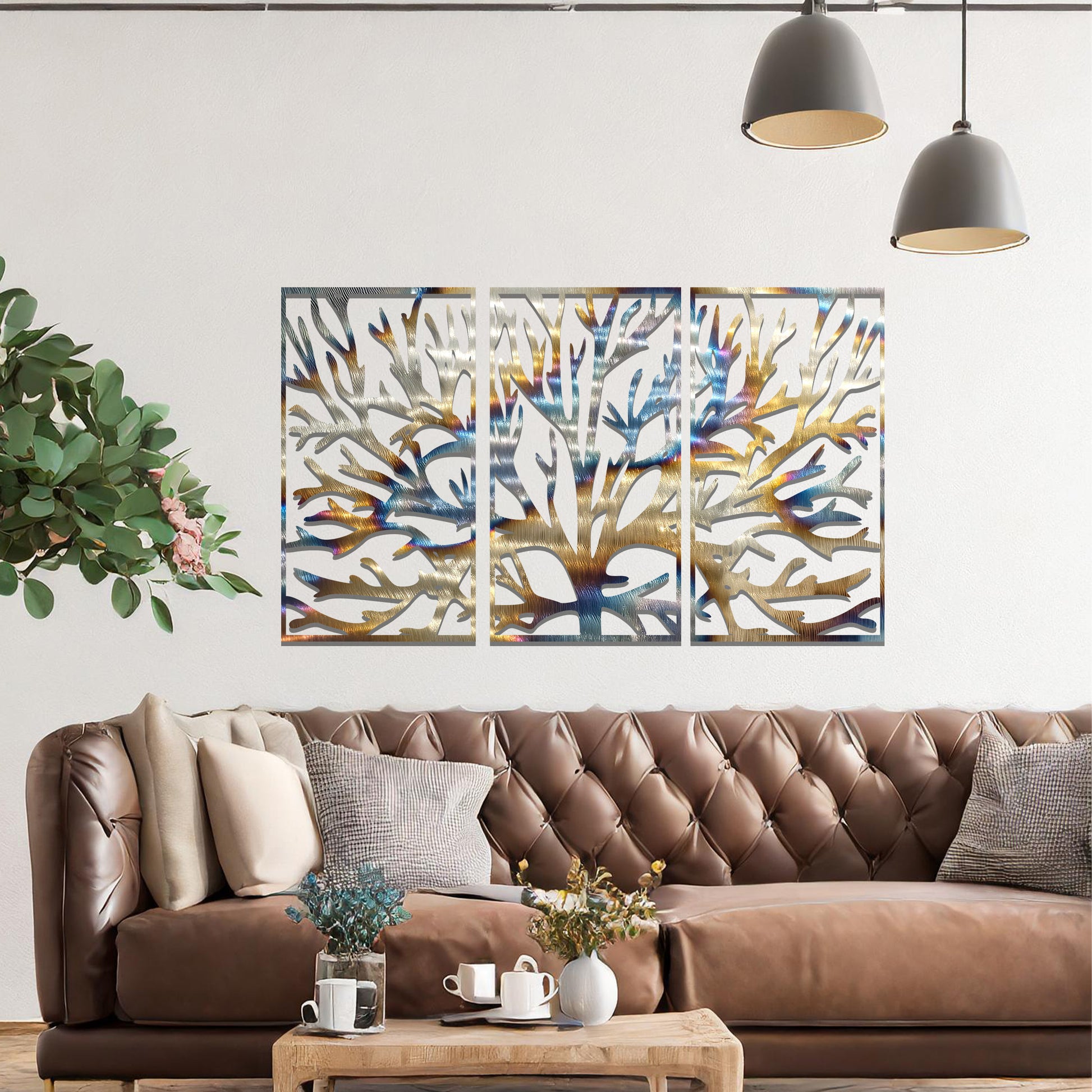 Metal wall art design featuring a stylized tree with intricate branches, presented in a triptych layout. The design captures detailed, organic lines forming the tree’s structure, emphasizing the natural flow and texture of the branches. The art is displayed on a neutral wall.