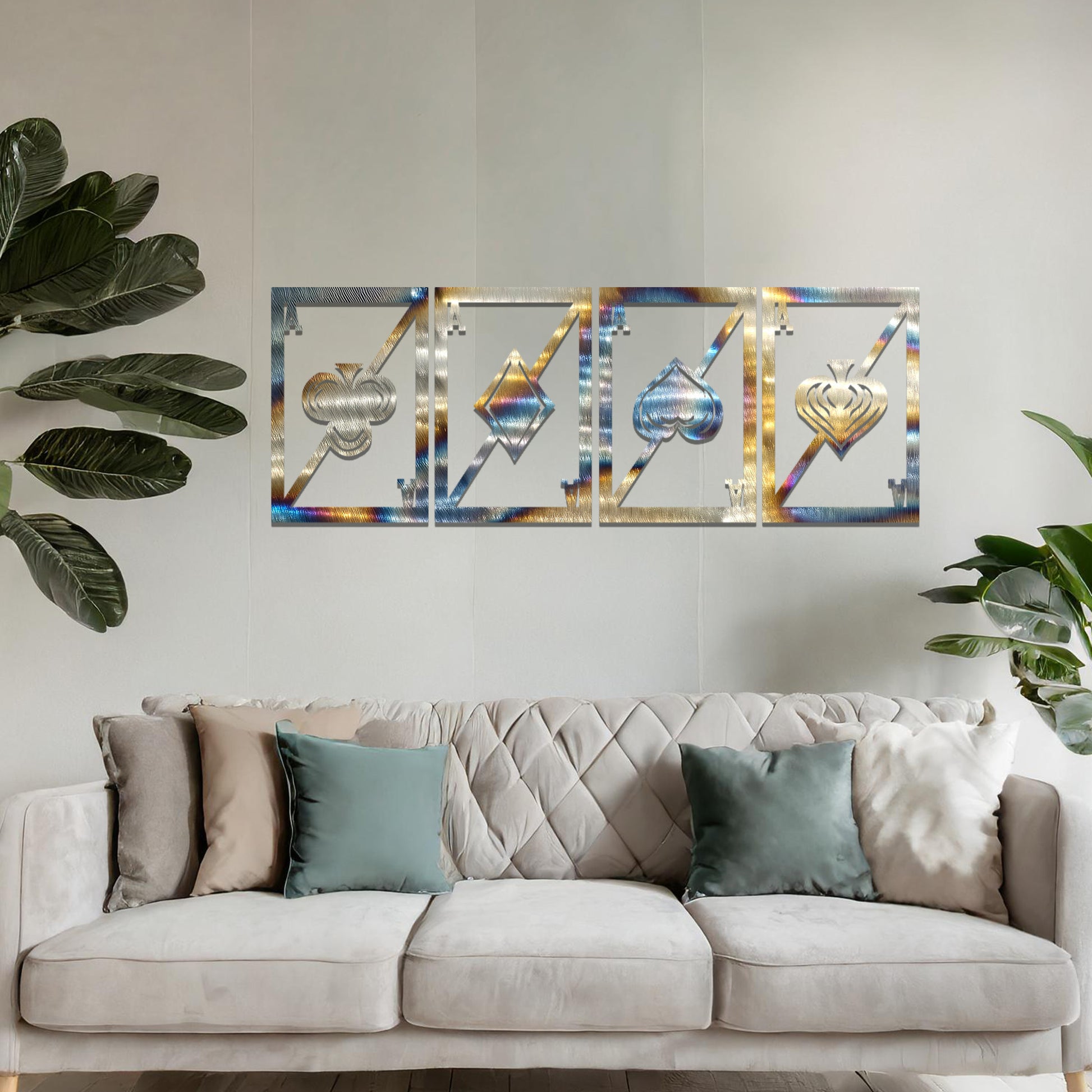 Metal wall art featuring a four-panel design inspired by playing card suits—clubs, diamonds, hearts, and spades—each framed with a modern aesthetic, creating a bold statement piece in the interior setting.
