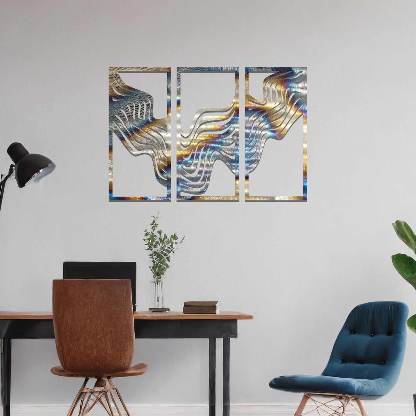 Metal wall art set of three panels featuring flowing, wave-like patterns. The design flows across the panels with a smooth, dynamic movement. The art is placed on a neutral wall in a modern living room, enhancing the space with a sleek, contemporary feel.