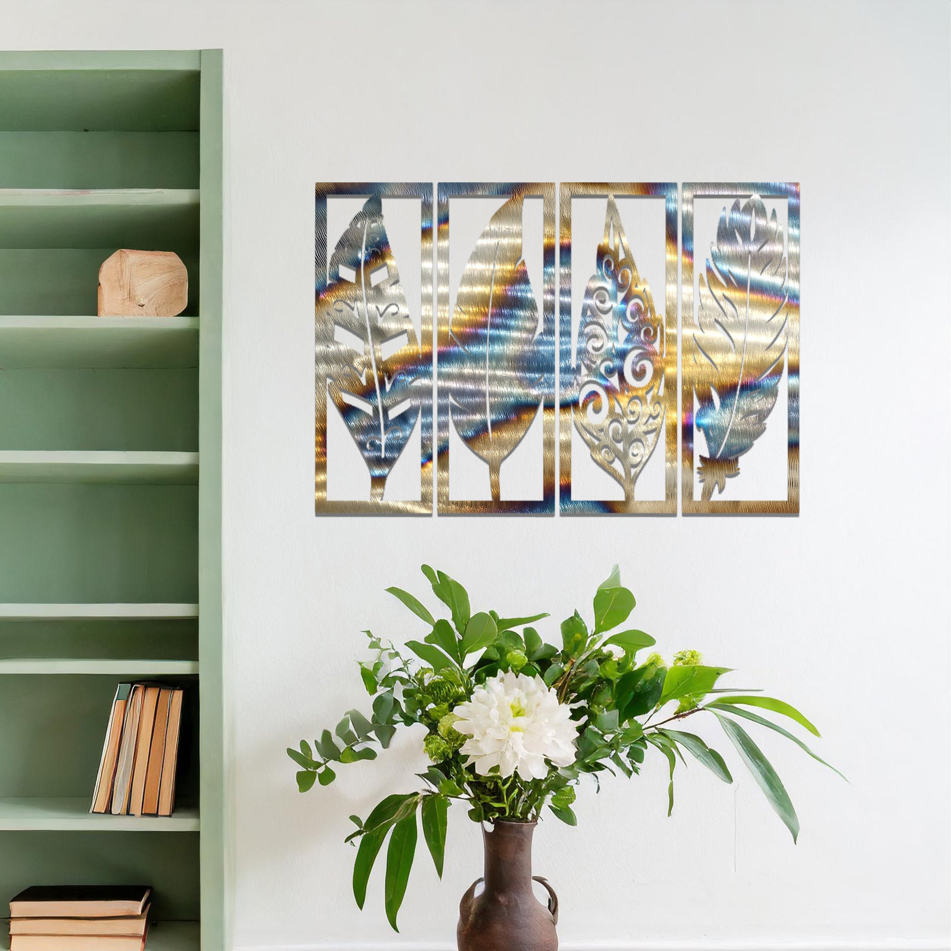 Metal wall art featuring five rectangular panels with detailed leaf designs, each panel showcasing a unique pattern. The art is mounted on a neutral wall within a modern office setting, adding a natural touch to the workspace decor.