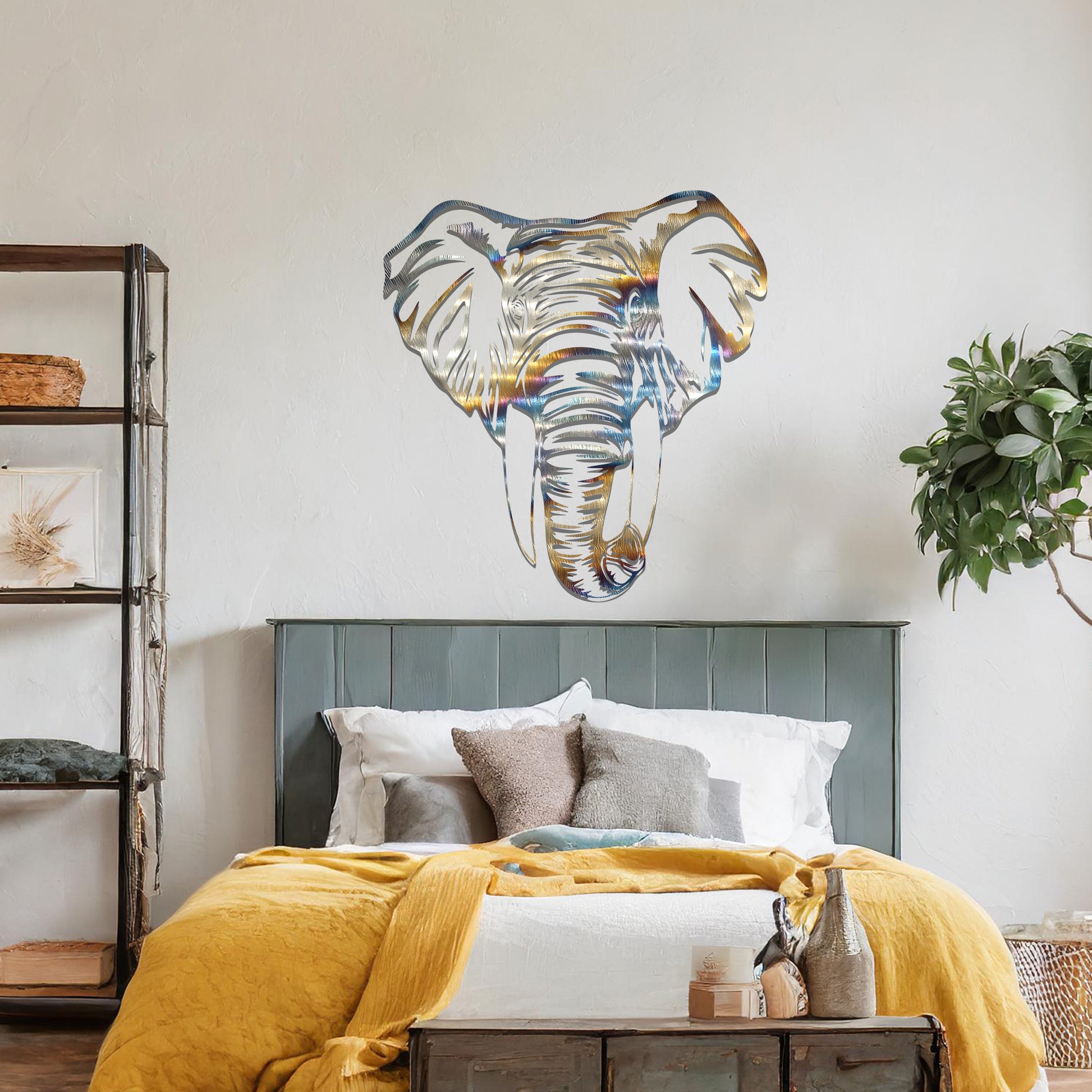 Metal wall art featuring a detailed elephant head design with intricate lines and realistic features, crafted with precise laser-cut techniques, displayed on a neutral wall within modern decor.