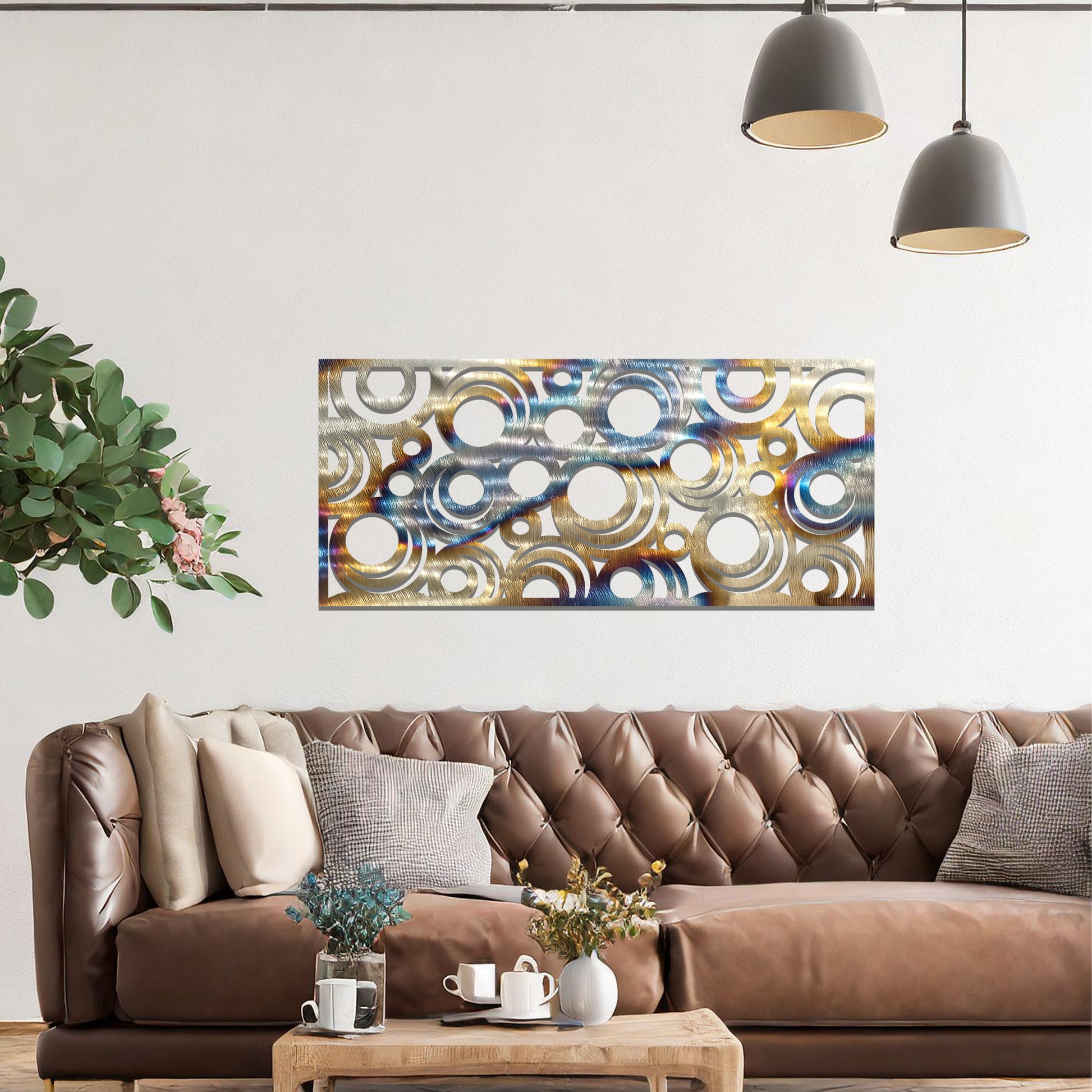 Metal wall art featuring an intricate pattern of overlapping circles in various sizes. The design is set against a neutral wall in a modern living room space, adding a touch of contemporary elegance to the decor.