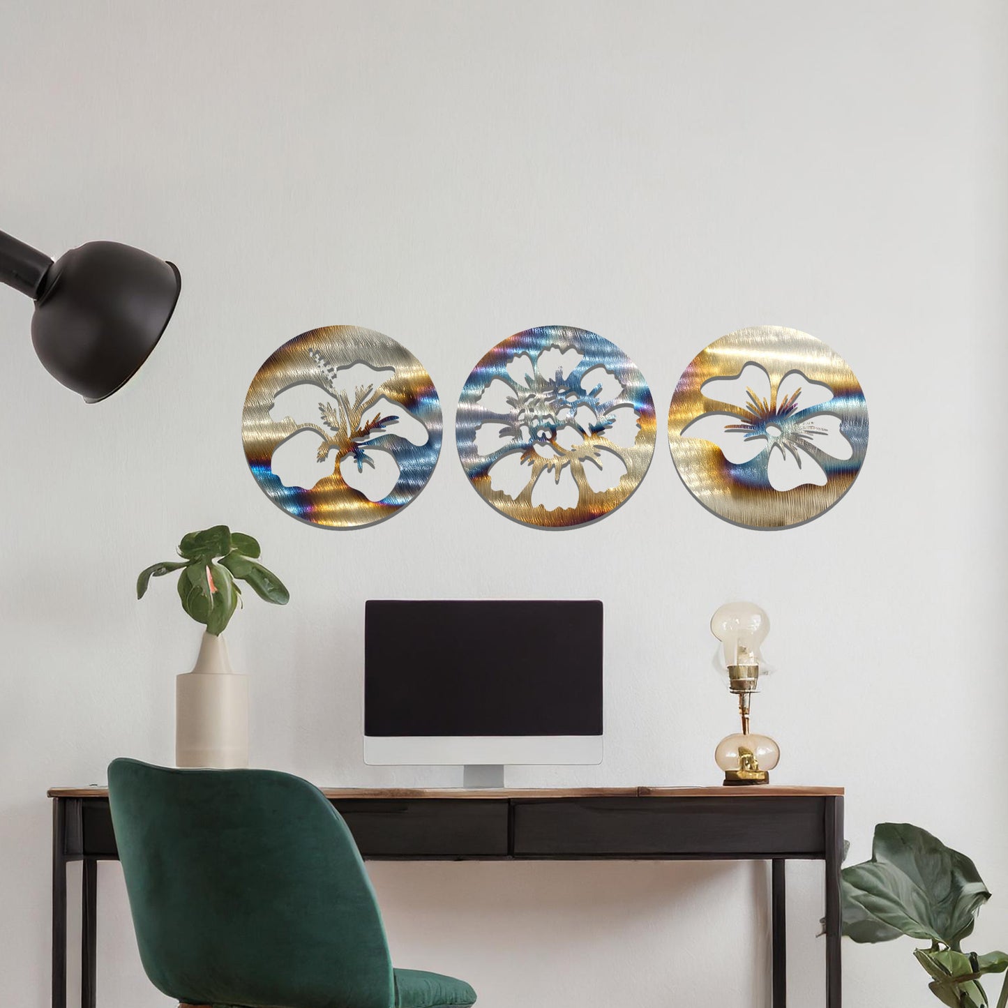 A set of three circular metal panels featuring floral designs, each panel showcasing a different flower in intricate detail. The artwork is displayed on a neutral wall, enhancing the serene and natural ambiance of the bedroom.