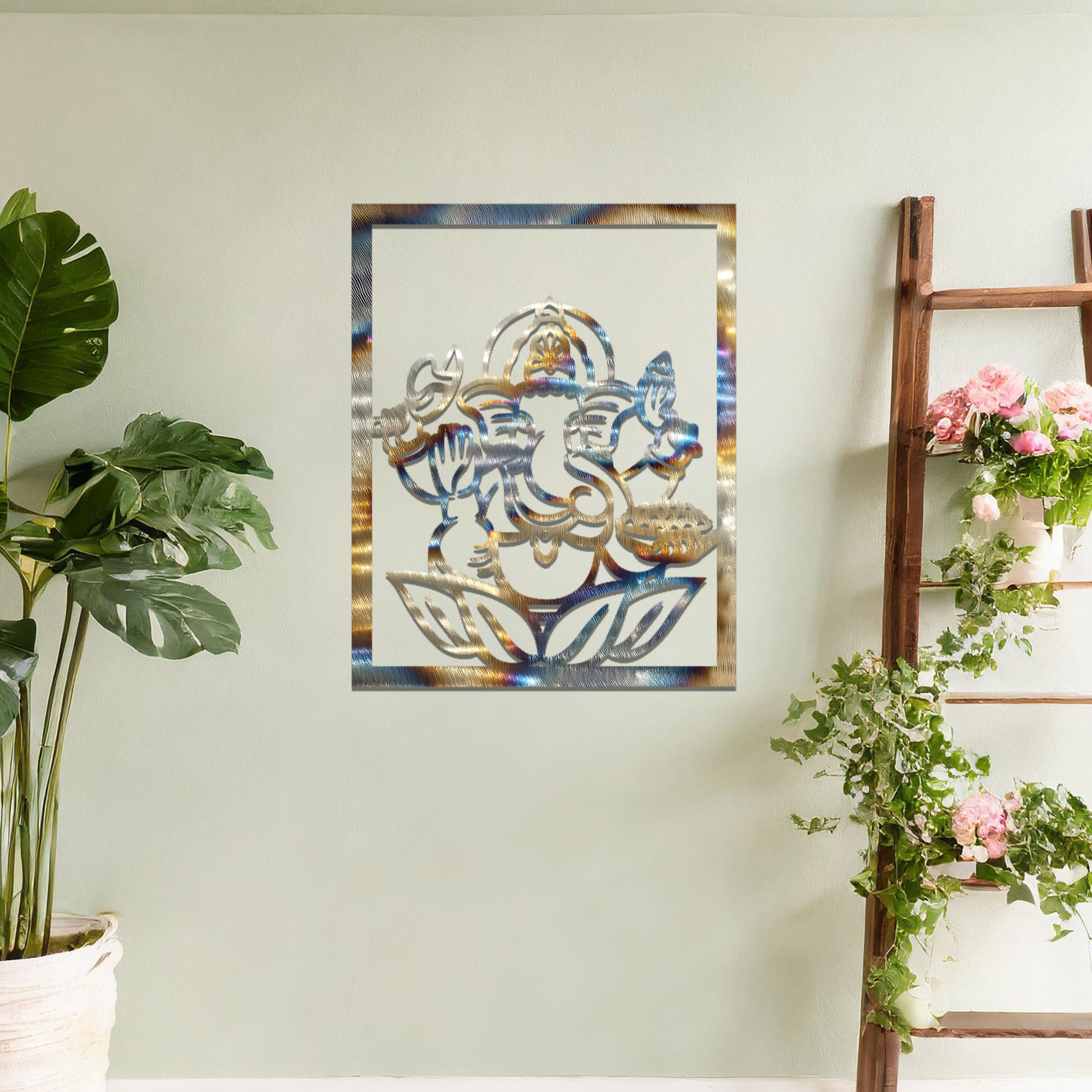 Metal wall art featuring a rectangular design of Lord Ganesha sitting on a lotus, showcasing intricate detailing of the deity's form and symbolic elements, mounted on a neutral wall within modern room decor. The craftsmanship adds a spiritual and artistic touch to the space.