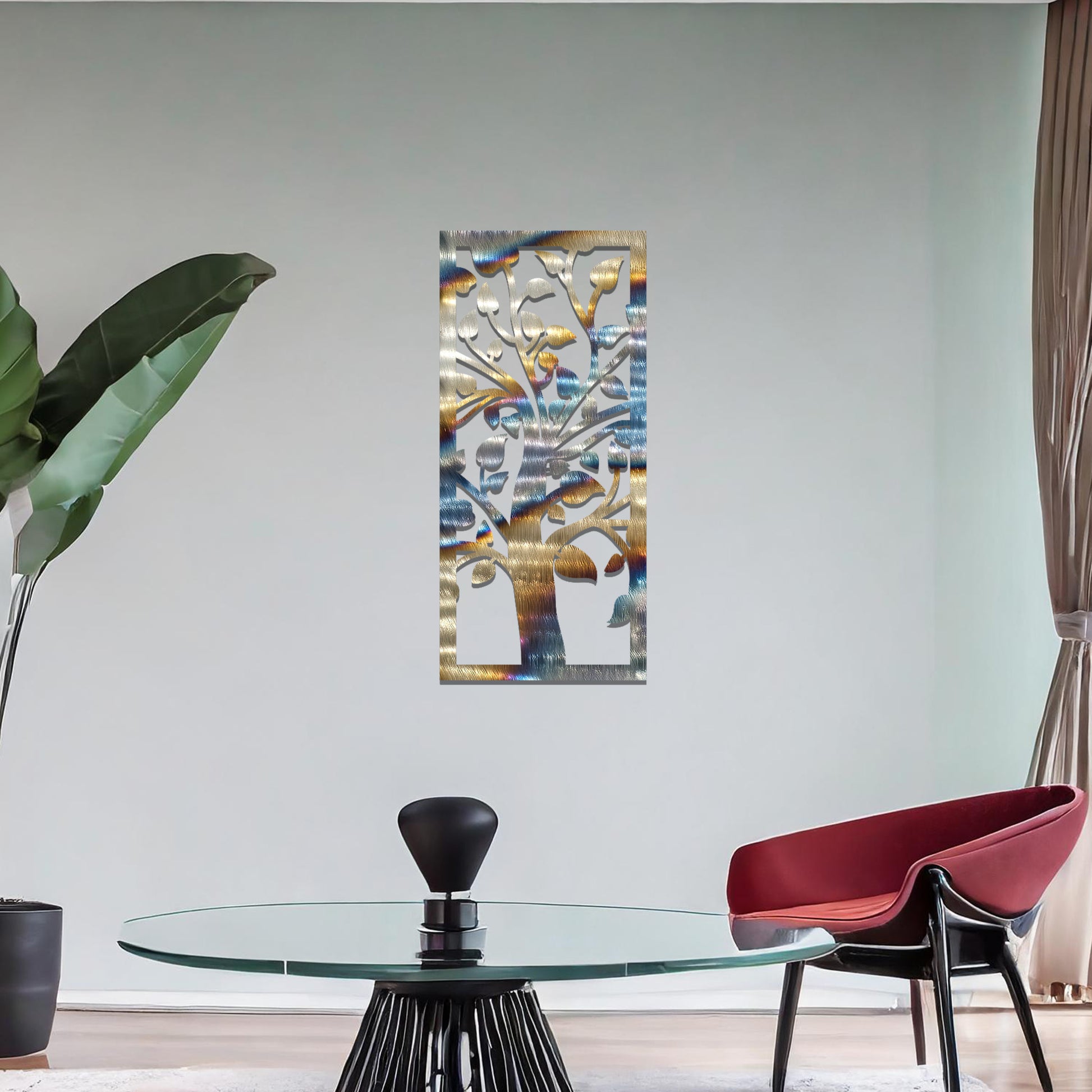 Metal wall art featuring a rectangular design with a stylised tree motif, showcasing flowing branches and leaves, mounted on a neutral wall within modern room decor. The minimalist craftsmanship adds a sleek and natural aesthetic, enhancing the contemporary elegance of the space.