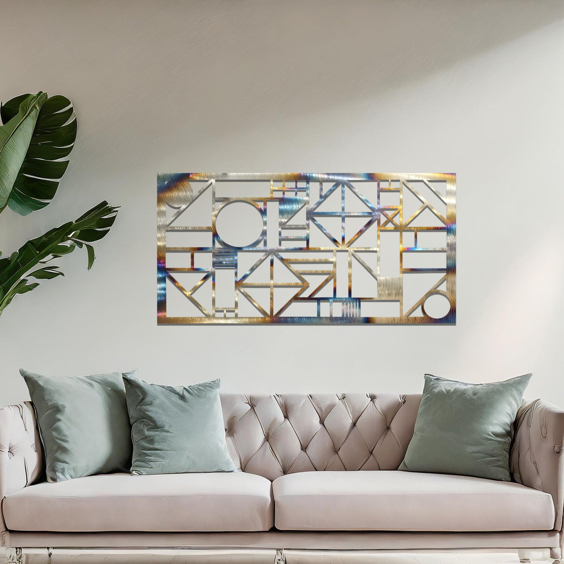 Metal wall art with a geometric design, featuring various abstract shapes, lines, and angles arranged in a structured composition. The art is placed on a neutral wall within modern room decor, adding an artistic touch to the space.