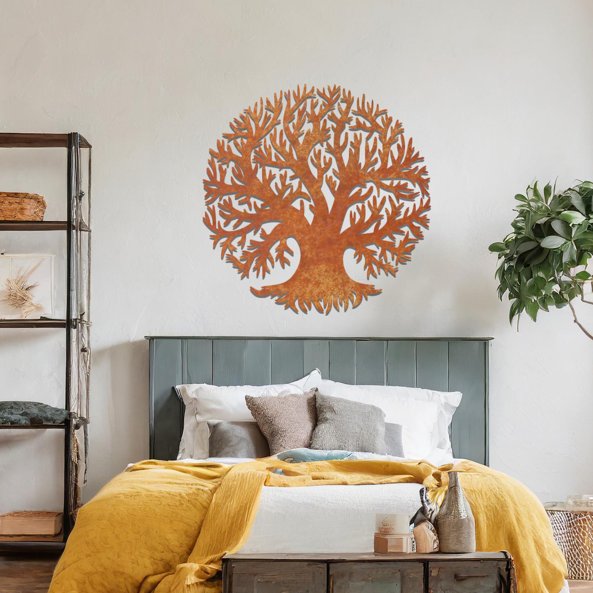 Metal wall art featuring a circular tree design with intricate branches and roots, crafted with precise laser-cut detailing, placed on a neutral wall within modern decor.
