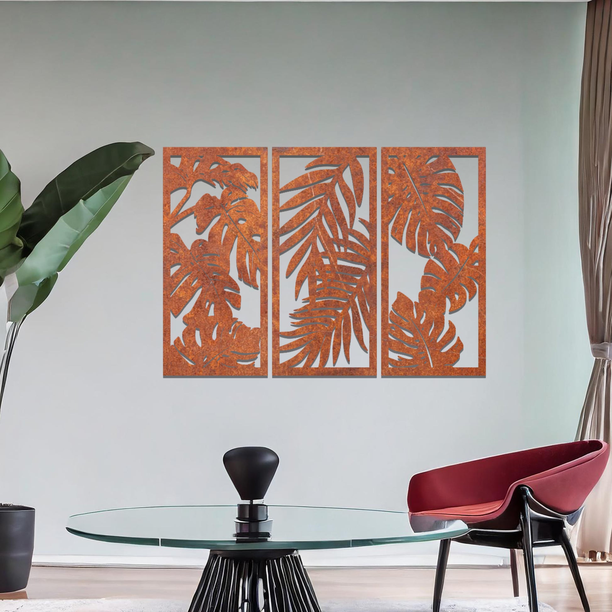 A tropical wall art set featuring a trio of panels adorned with intricate monstera and palm leaf patterns. Perfect for bringing a lush, botanical vibe to your indoor spaces.