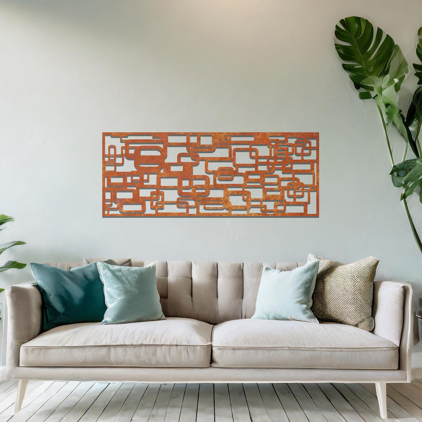 Metal wall art featuring an abstract geometric design with overlapping and interlocking rectangular shapes. The artwork is placed on a neutral wall in a modern living room, complementing contemporary decor with its dynamic and stylish form.
