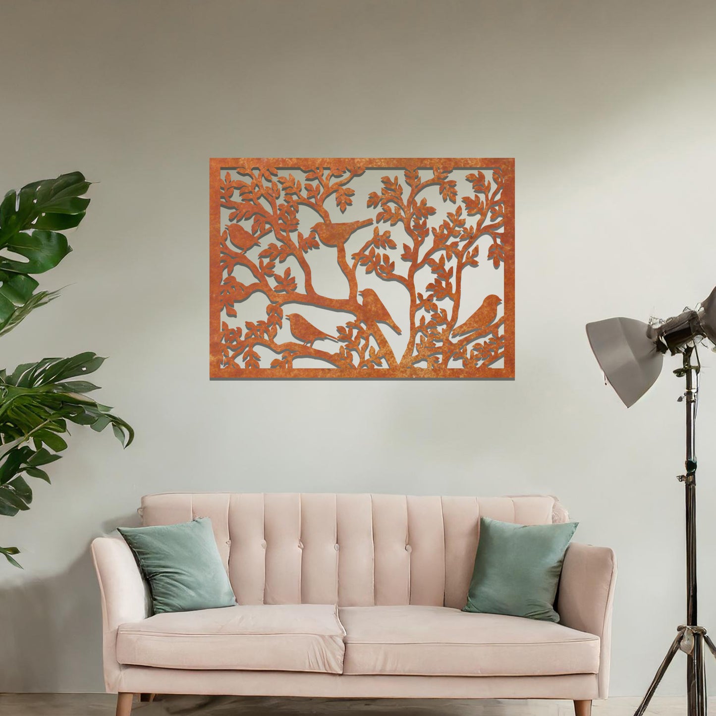 An intricately designed wall art piece showcasing birds perched on branches surrounded by delicate leaves, bringing a serene and natural touch to your interior space.